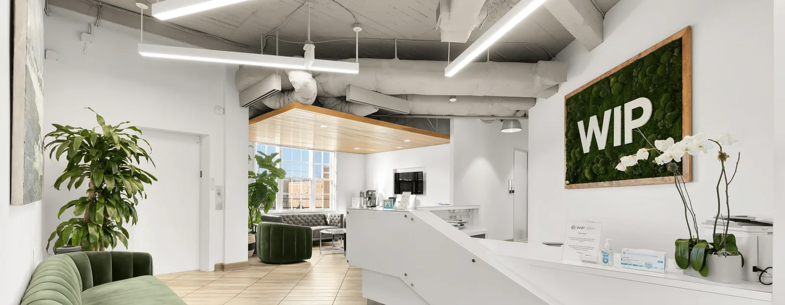 Signed WIP reception area at the 4325 49th Street office.