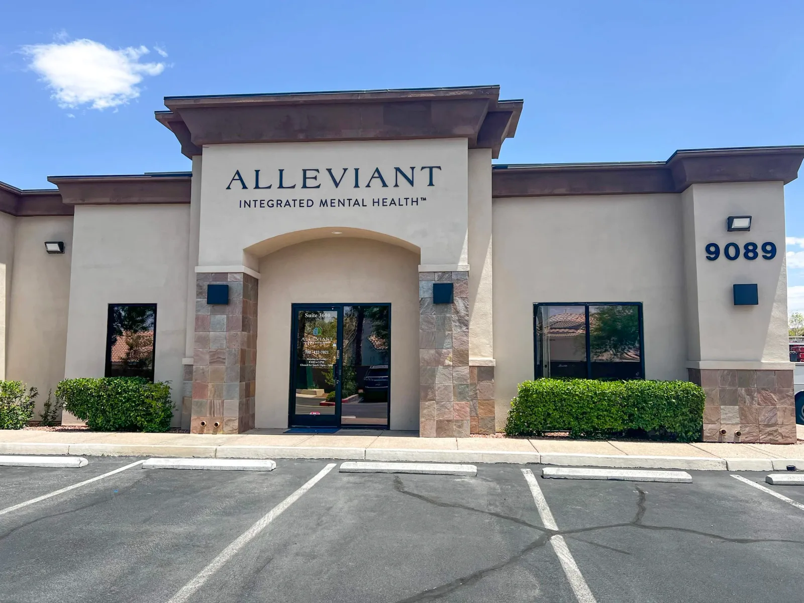 Exterior entrance with Alleviant signage and 9089 address