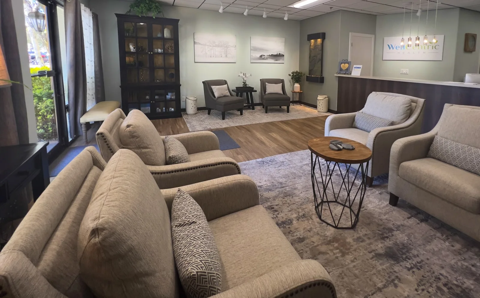 WellCentric reception and lobby with practice branding.