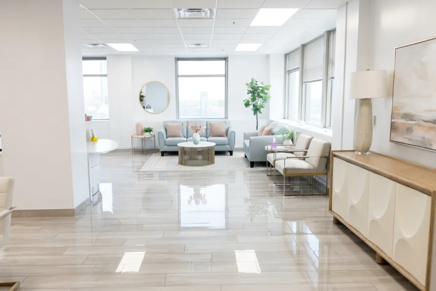 Empty Jacksonville Serenity lobby with reception seating and indoor plants.
