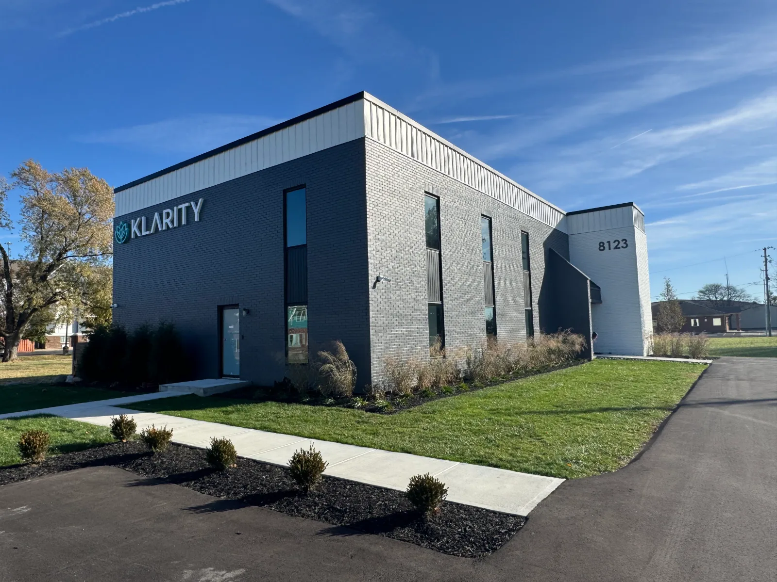 Signed Klarity Castleton clinic exterior, showing the building and landscaped entrance.