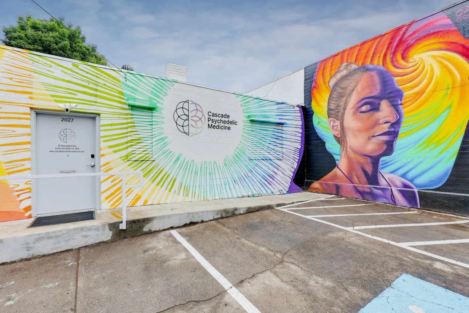Signed Cascade Psychedelic Medicine exterior with its clinic mural.