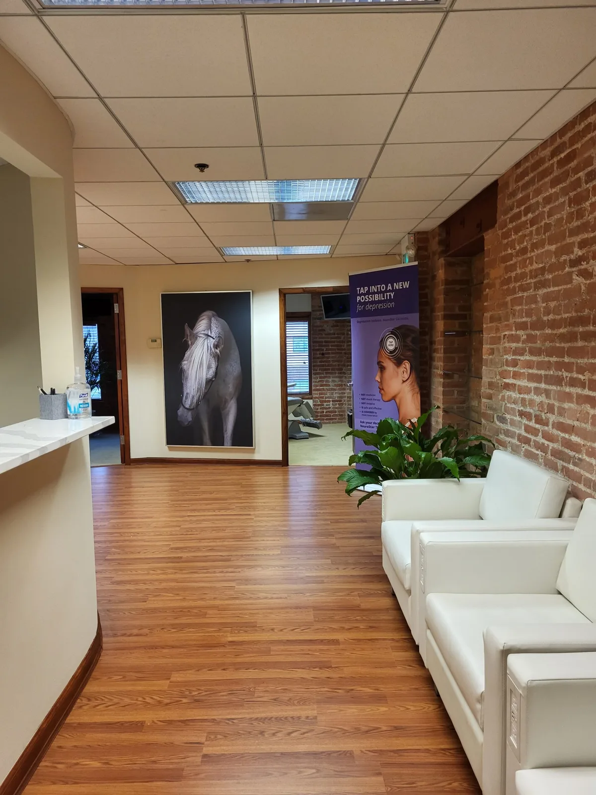 Omi Psychiatry reception/corridor and waiting area, without people.