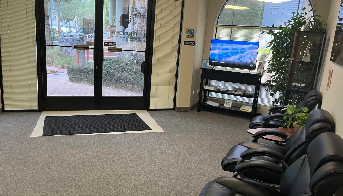 Thunder Pain and Wellness waiting area and signed entrance.