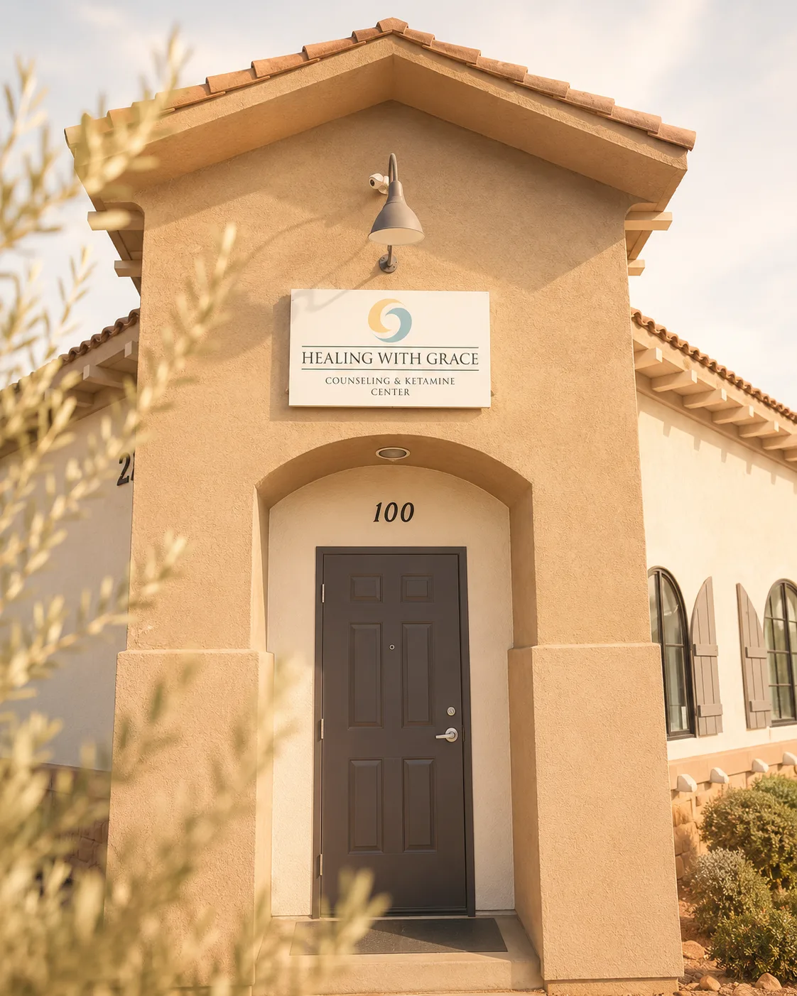 Clinic entry with Healing with Grace sign and suite 100