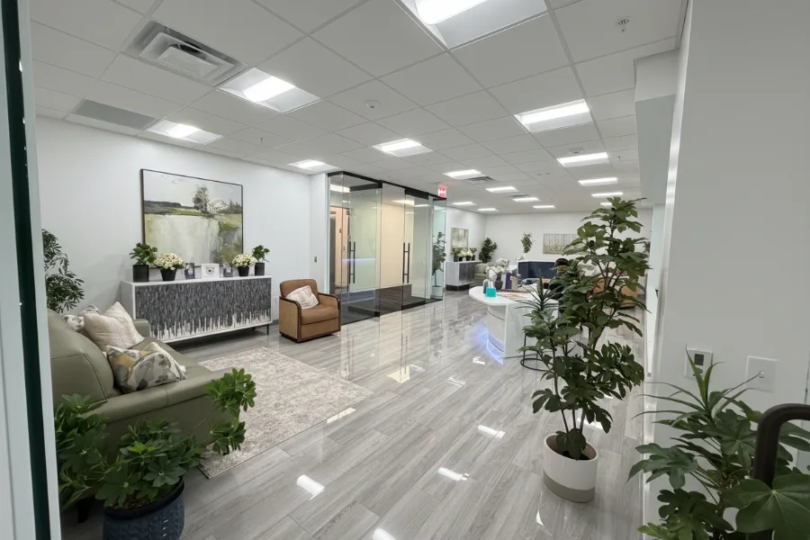 Empty Orlando clinic lobby and reception with seating and plants.