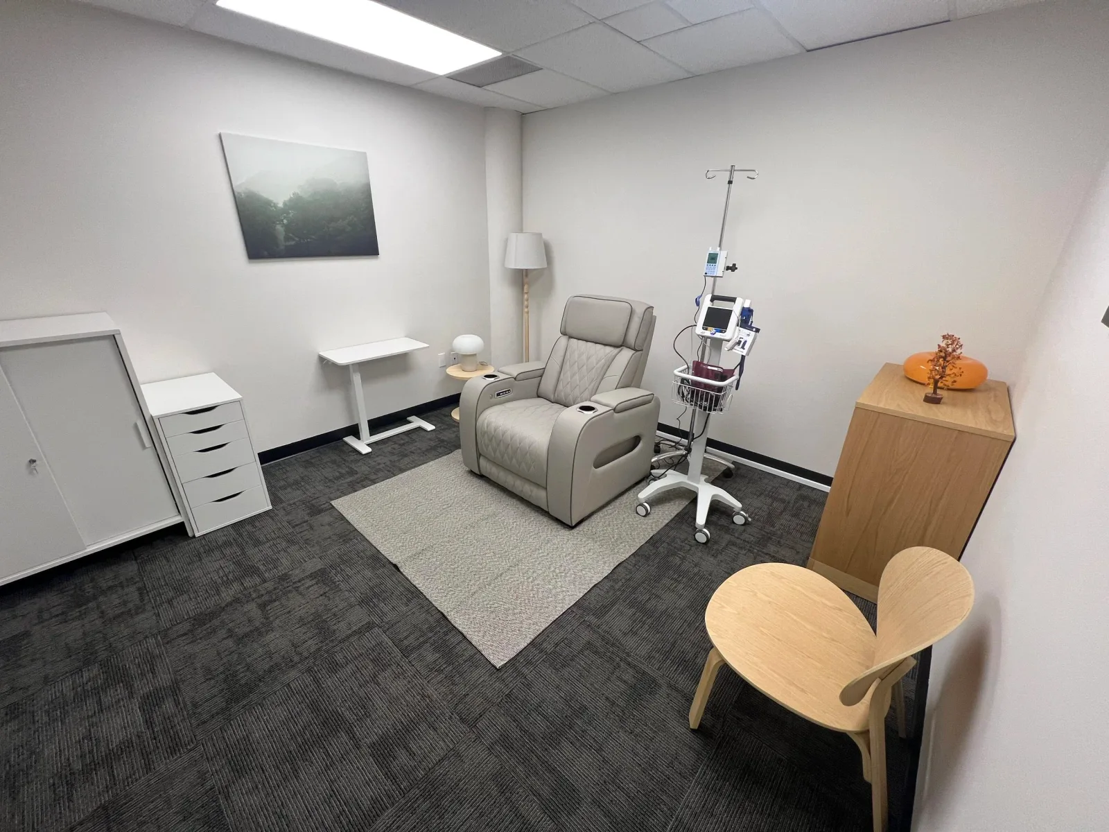 Empty EVE clinic IV treatment room with reclining chairs.